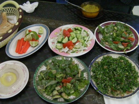 four plates of salad