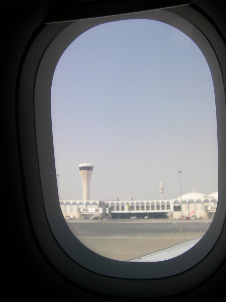 view out plane window of airport control tower