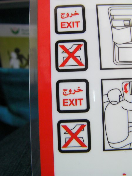 airplane safety sheet showing a red X through something indistinguishable