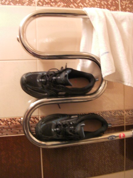shoes placed on the heated towel rack