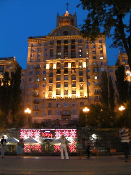 beautiful building with fountain, lit after dark