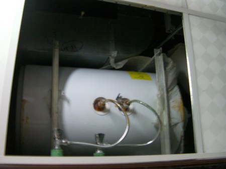 small water heater installed in ceiling space