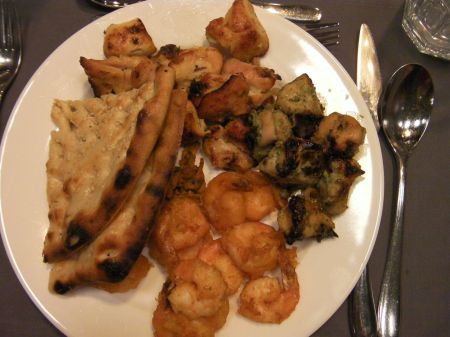 plate of chicken, shrimps, and bread