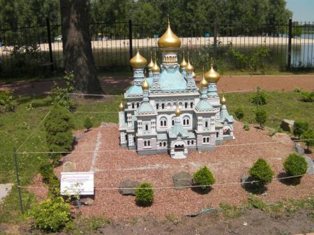model of a blue church with golden domes