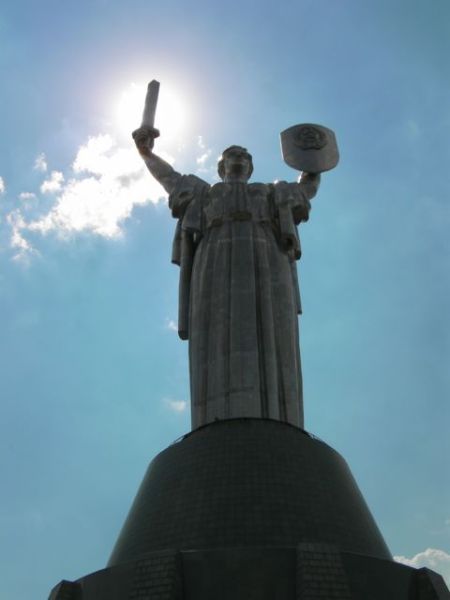 stainless steel statue of a woman holding a shield and a sword stands 62 meters tall 