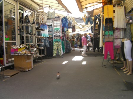 rows of metal sheds housing goods for sale