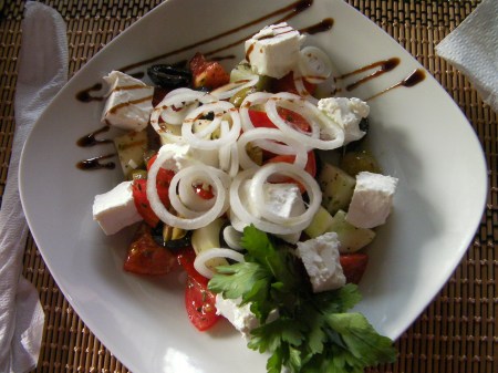 salad of cucumber, tomato, onion, feta cheese, and olives.