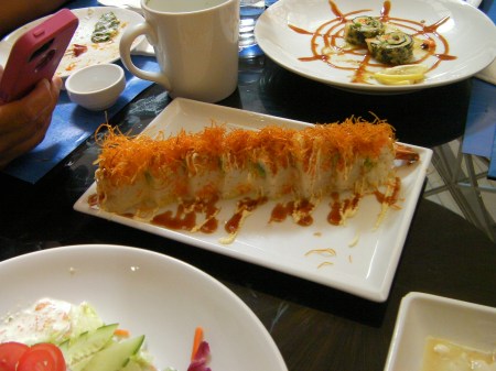 shrimp roll topped with fried carrot