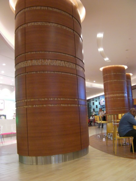 huge cement support column in a food court
