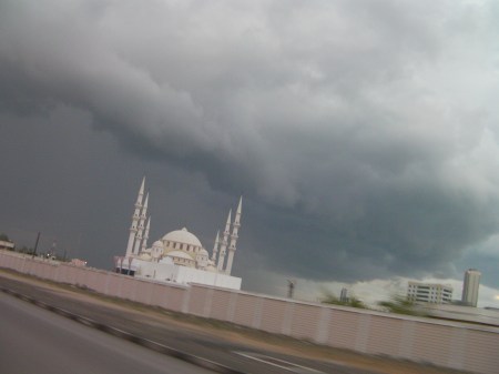 Mosque and dark grey clouds