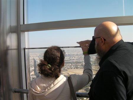 two people looking out from the observation deck