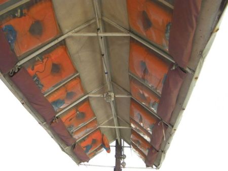 life preserver jackets attached to the underside of the boat roof