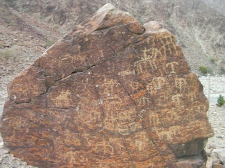 large boulder covered with petroglyphs