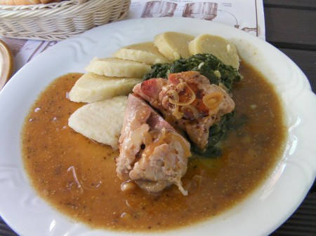 plate with duck, spinach, dumplings