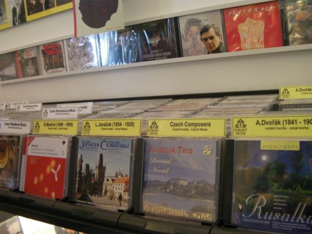 rows of compact discs in a music store