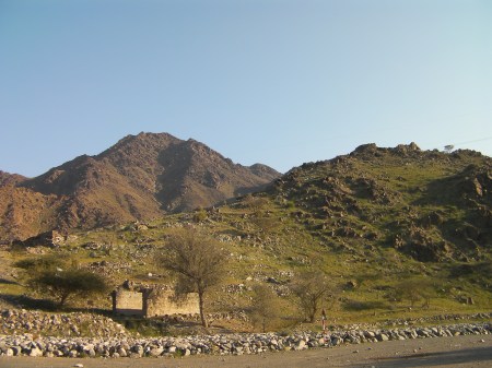 green hill with archeological ruins