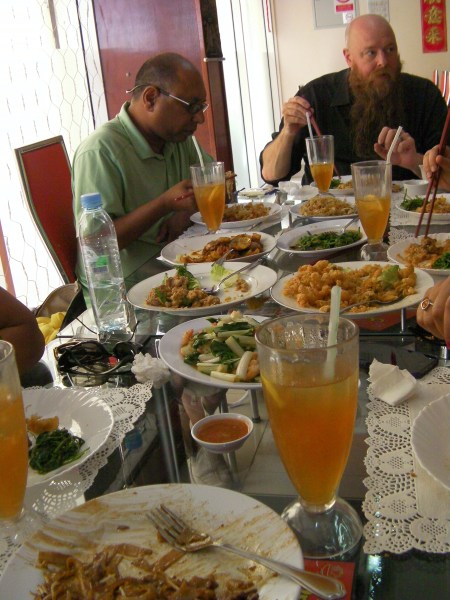 table filled with dishes of food