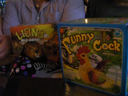 two boxed toys, lion and funny cock