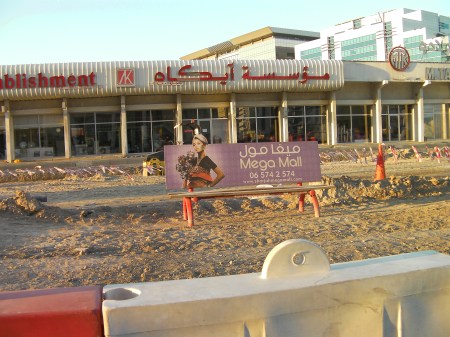 bus bench in the middle of a construction area