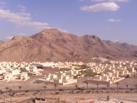 stone hills behind a town of white houses
