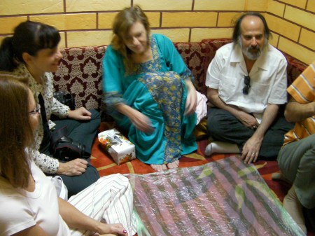 people sitting on a carpeted floor