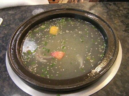 ceramic bowl containing broth