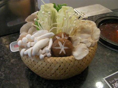 basket holding a variety of mushrooms