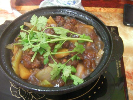 ceramic bowl of meat and potato stew