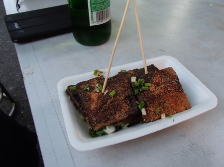 a plate of stinky tofu