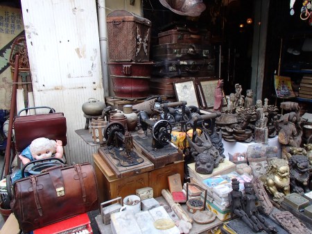 old sewing machines, statues, suitcases