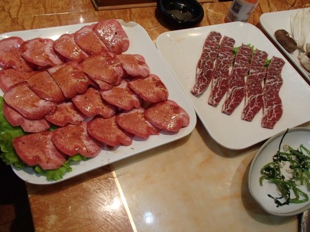 plates of sliced raw meat