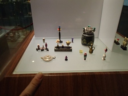 extremely tiny sculptures in a display case
