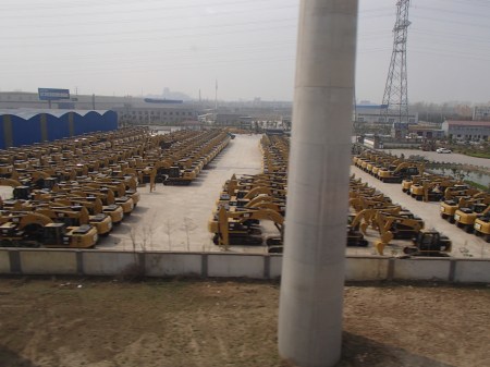 lot full of CAT heavy equipment vehicles