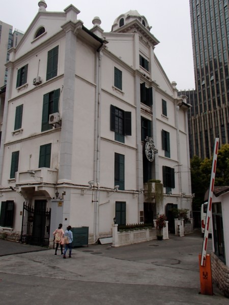 five story white building