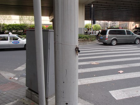a key ring tied to a lamp post