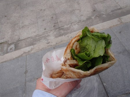 flat bread wrap with egg, cheese, and lettuce