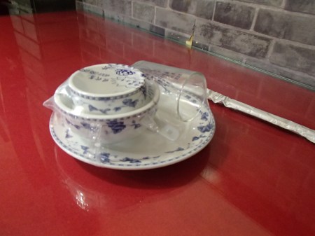 set of dishes wrapped in plastic