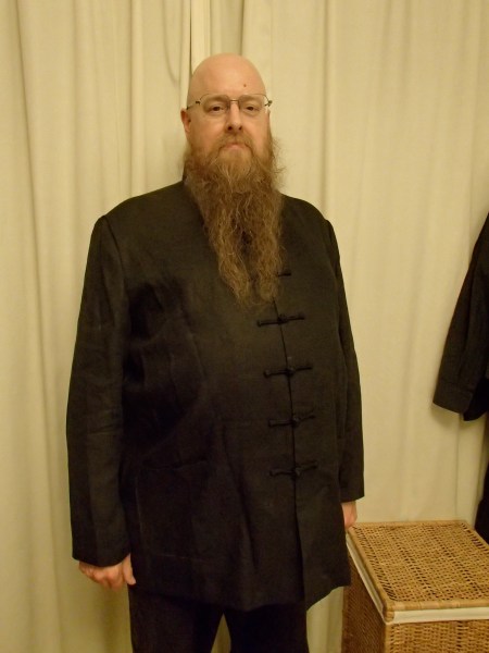 man in black linen Chinese tunic