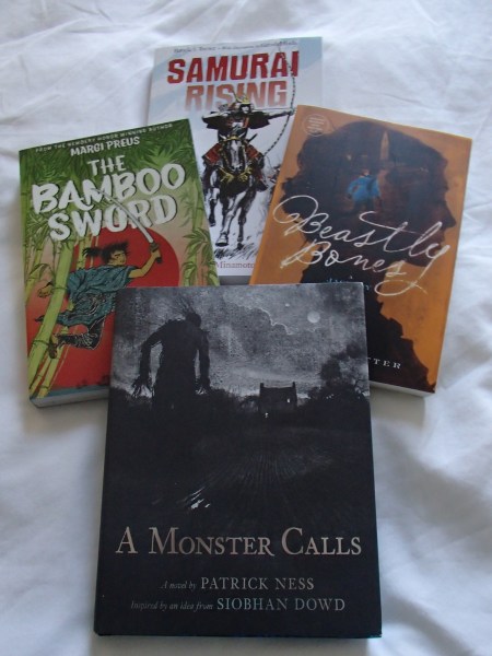 four books - Samurai Rising, Bamboo Sword, Beastly Bones, A Monster Calls