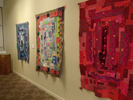 quilts hanging on a wall