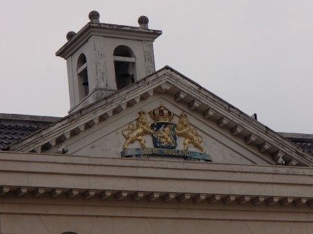 New Holland coat of arms on a two story restaurant building