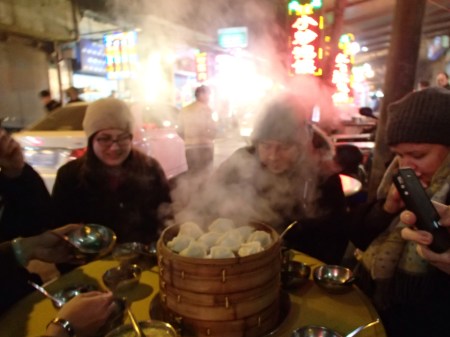 steaming basket of dumplings