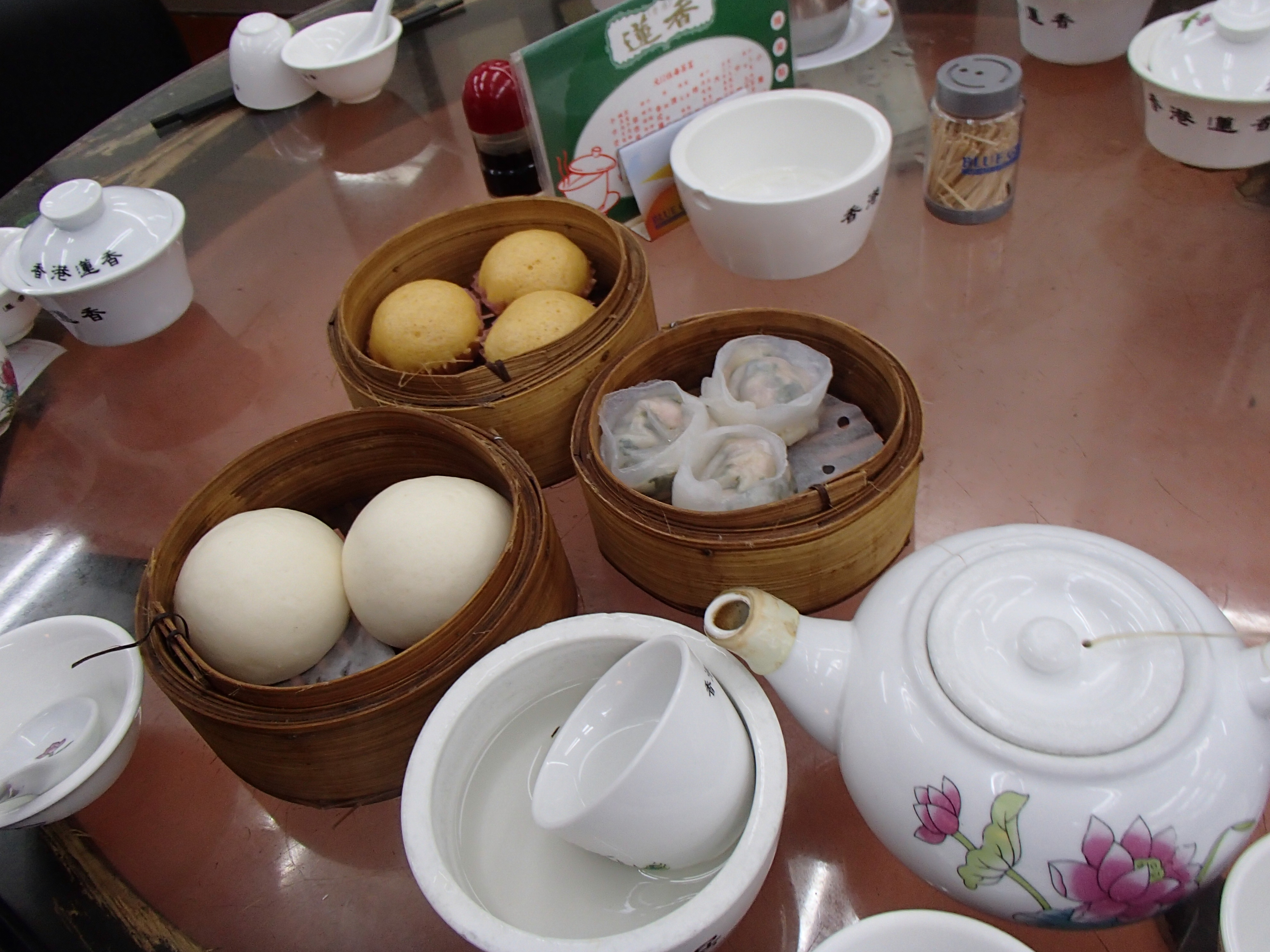 bamboo steam baskets full of dim sum buns