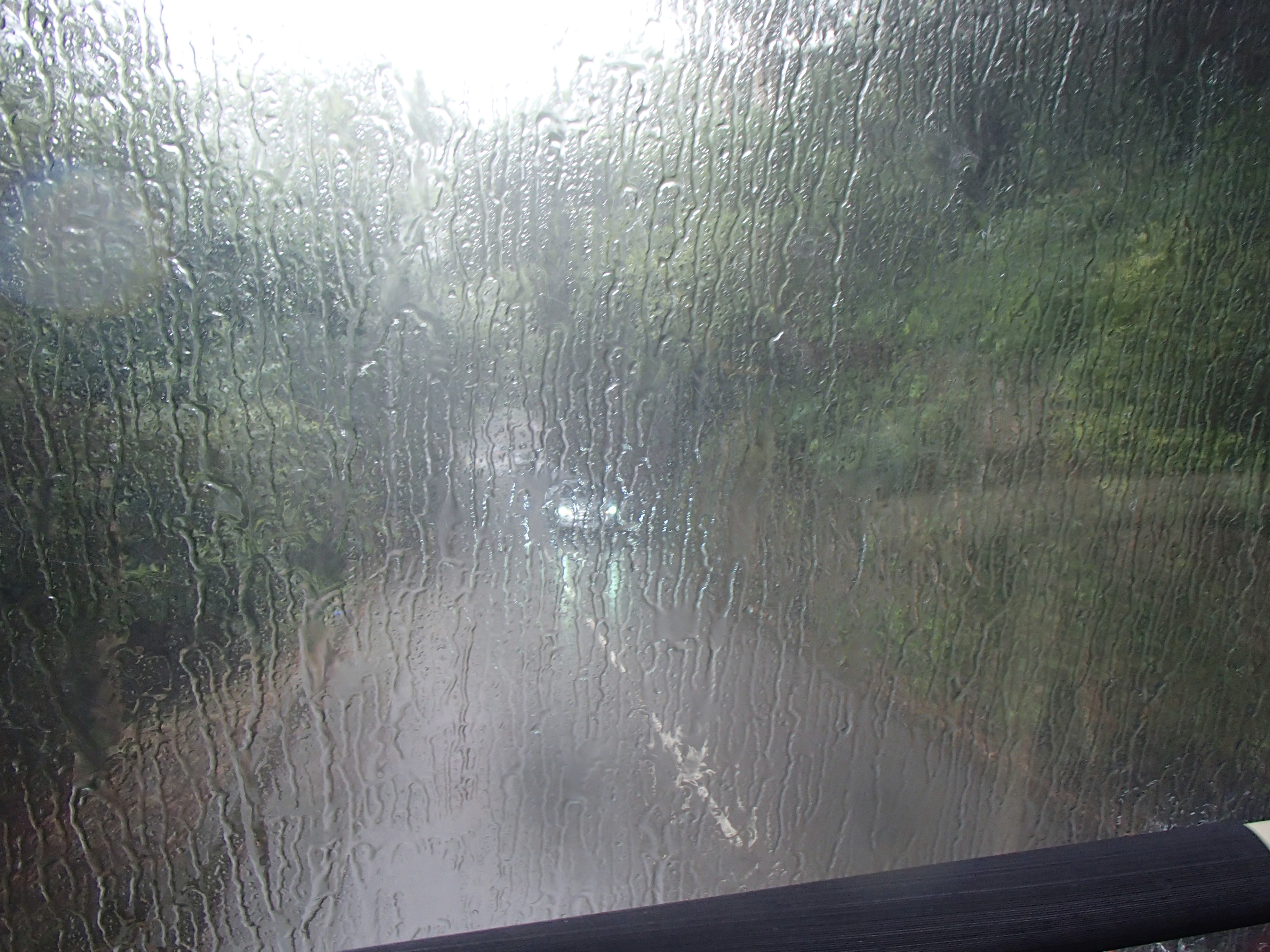 vehicle windshield obscured by rain
