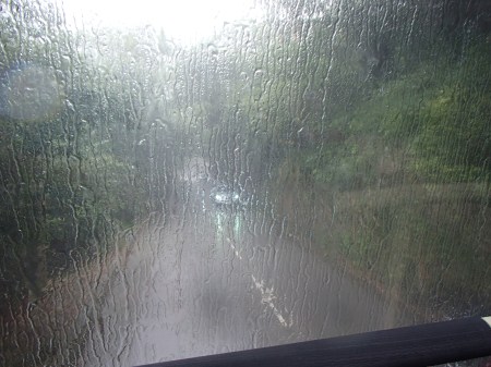 vehicle windshield obscured by rain