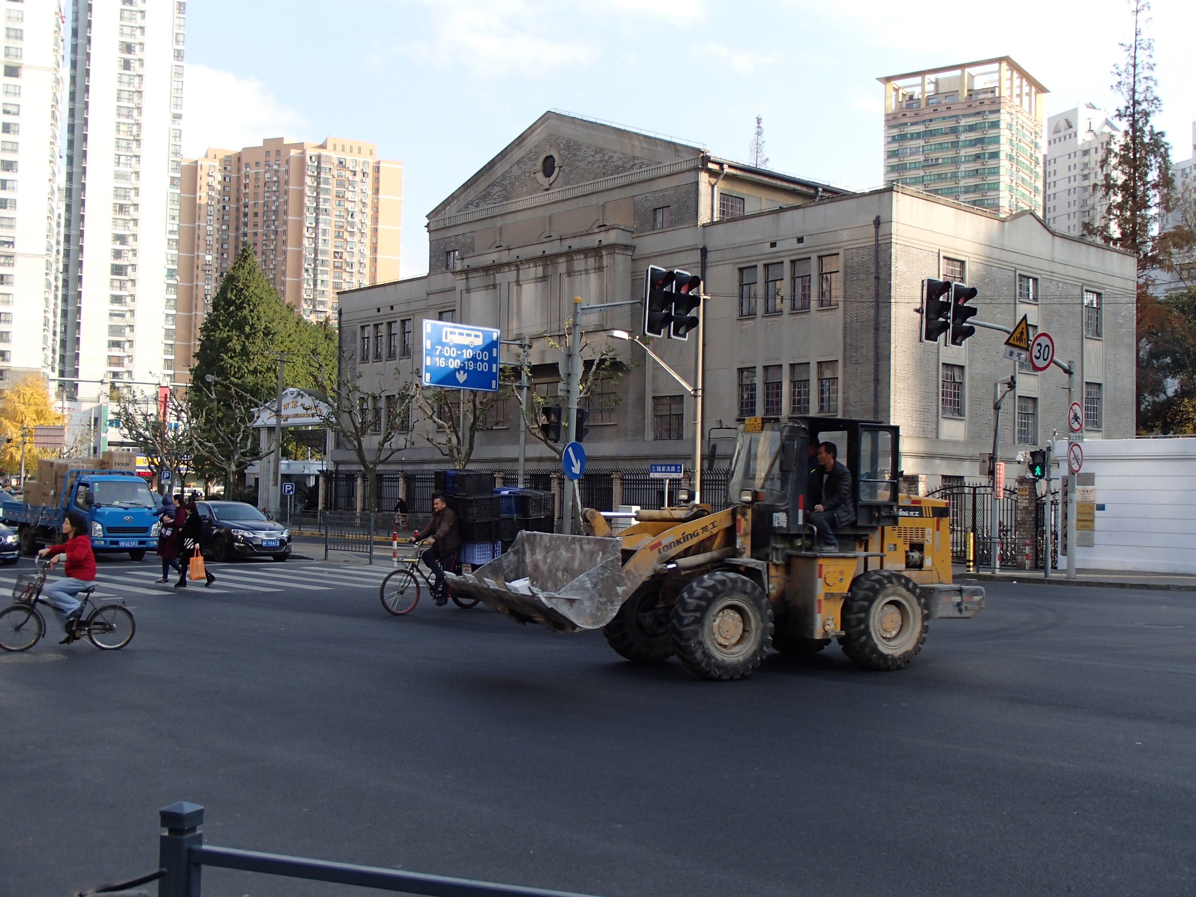 front loader tractor on city street