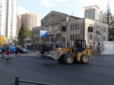 front loader tractor on city street