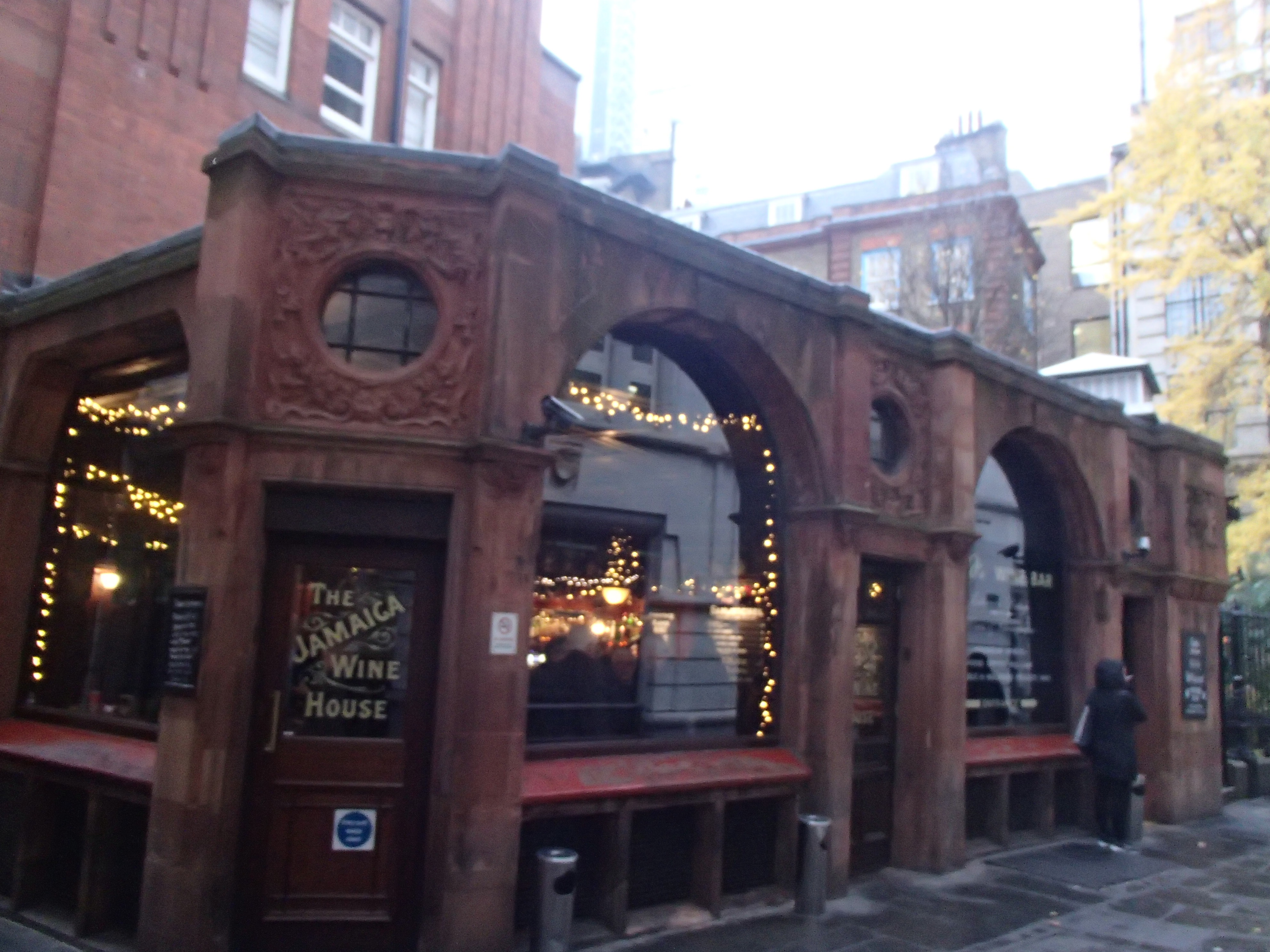 red stone building with arched windows