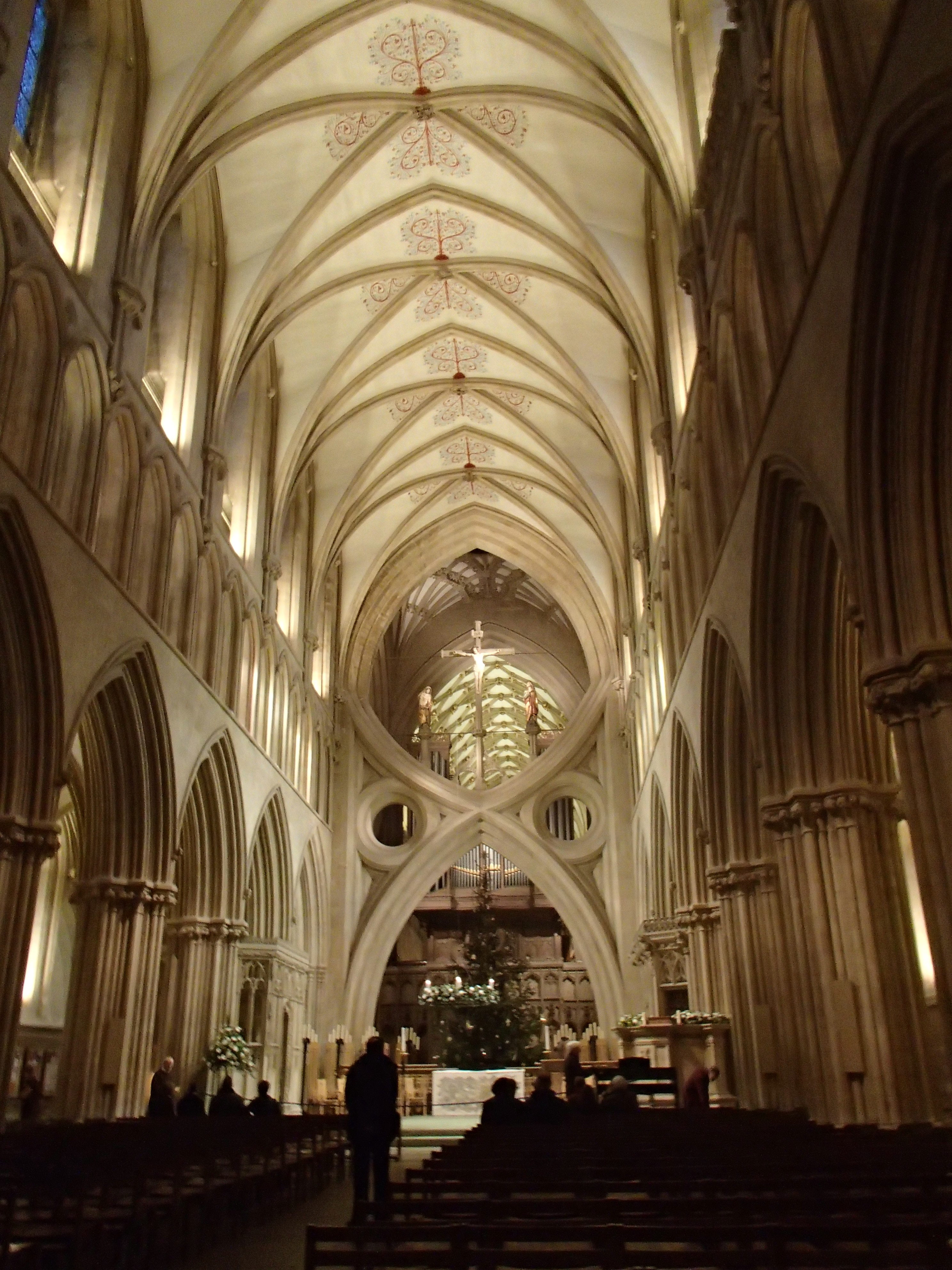 cathedral sanctuary with vaulted ceiling and scissor shaped arch