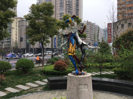 statue of two harlequin clowns